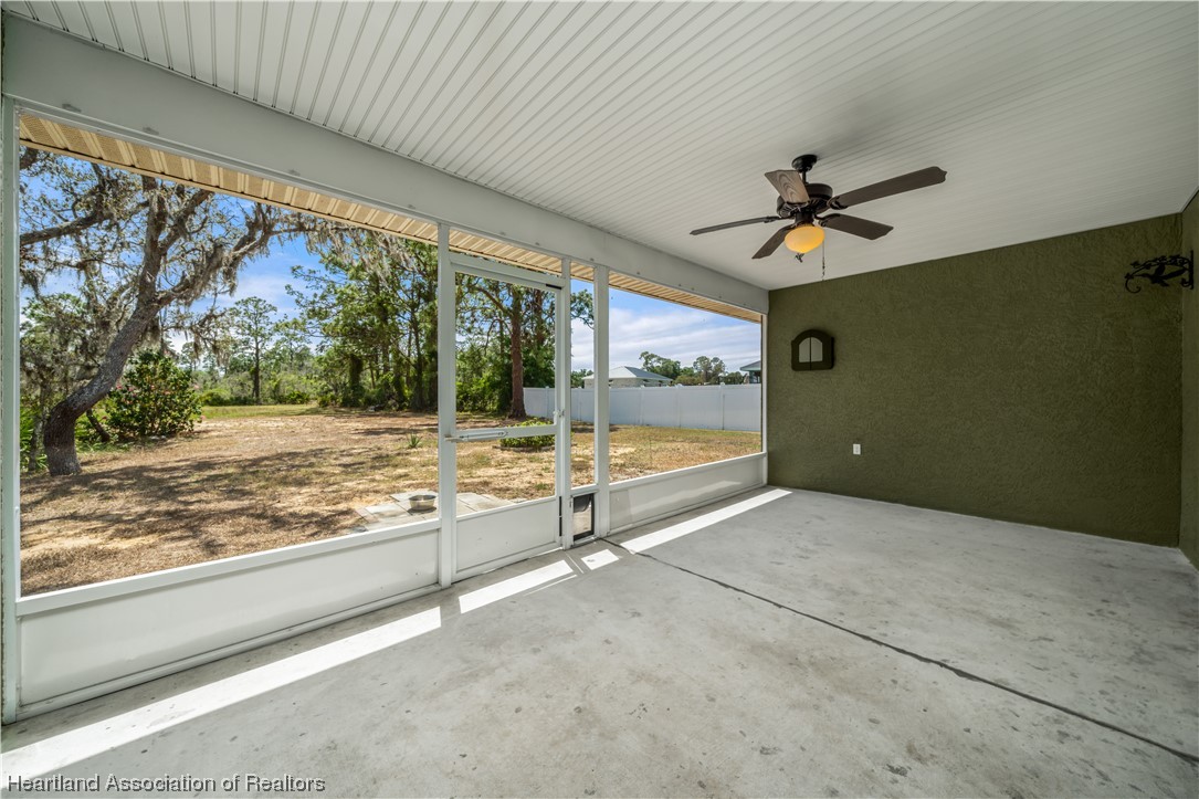 3519 Westminster Road Sebring, FL 33875 - Photo 26 of 31 a view of a livingroom with a ceiling fan and window