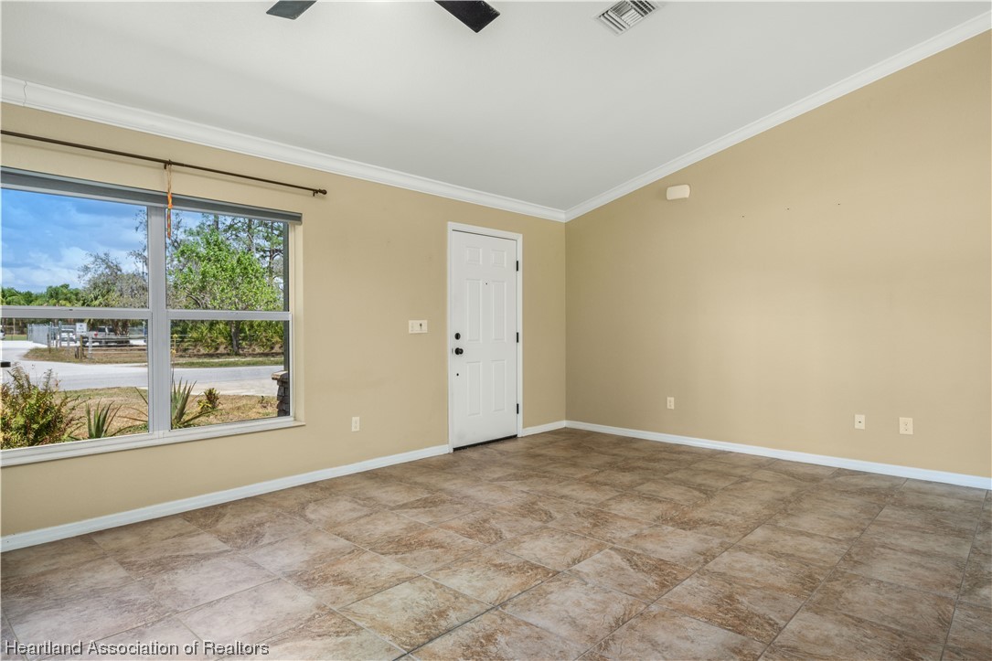 3519 Westminster Road Sebring, FL 33875 - Photo 3 of 31 a view of an empty room with a window