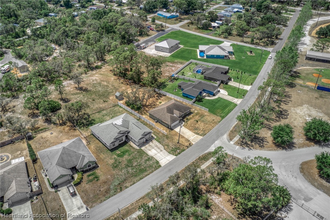 3519 Westminster Road Sebring, FL 33875 - Photo 31 of 31 an aerial view of multiple houses with yard