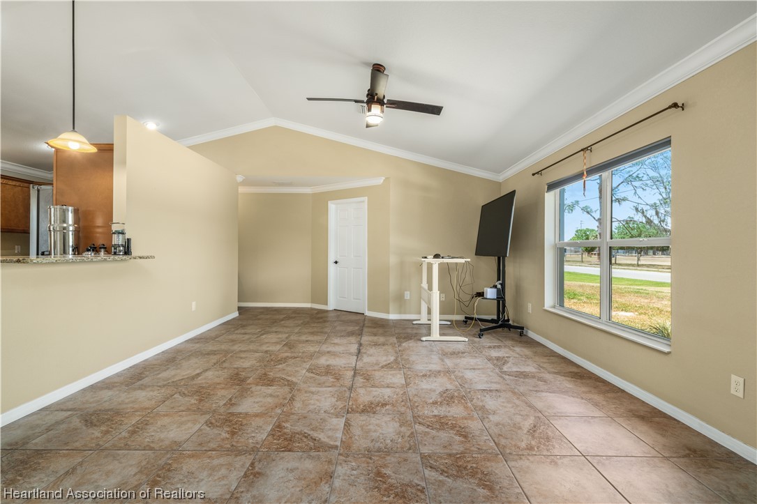 3519 Westminster Road Sebring, FL 33875 - Photo 4 of 31 a view of an empty room with a window