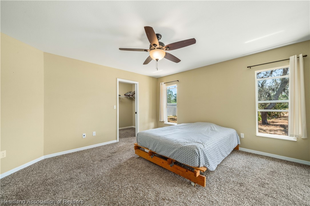 3519 Westminster Road Sebring, FL 33875 - Photo 6 of 31 a bedroom with a bed and a window