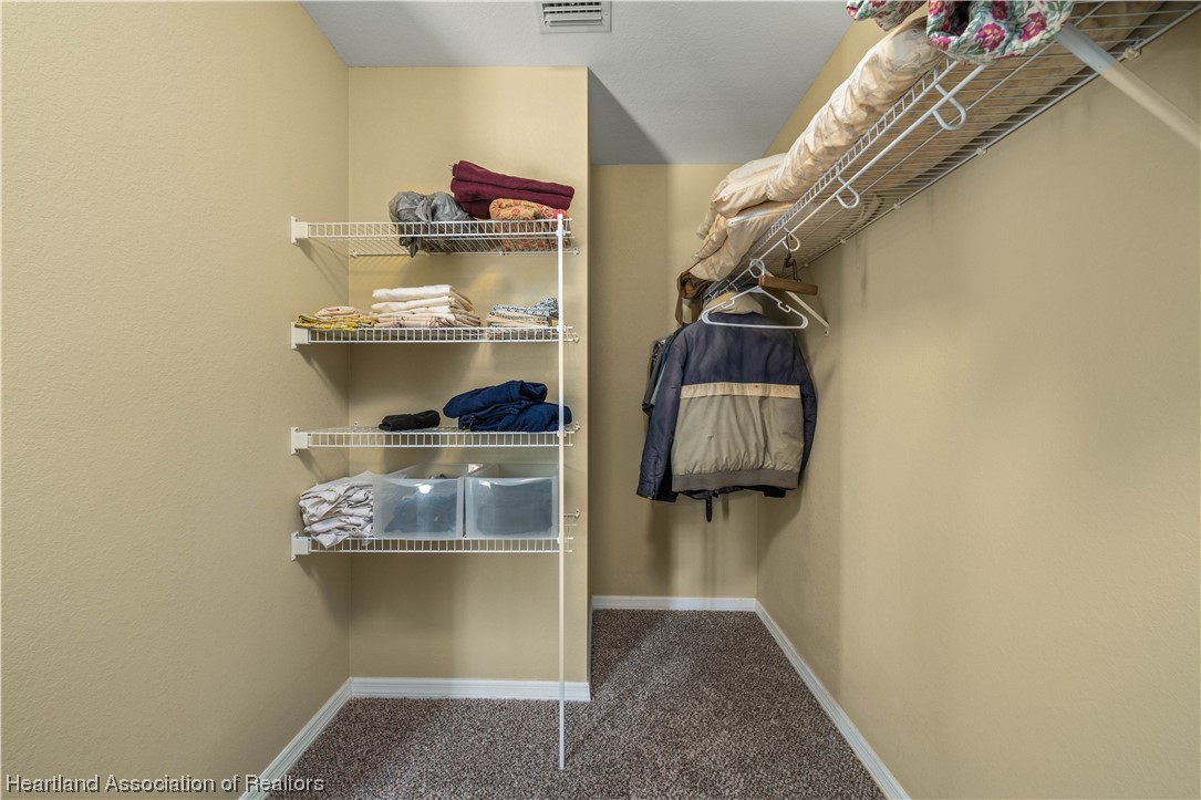 3519 Westminster Road Sebring, FL 33875 - Photo 10 of 31 a view of walk in closet with clothes and shoes