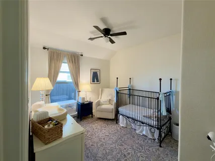 a bedroom with furniture and a window