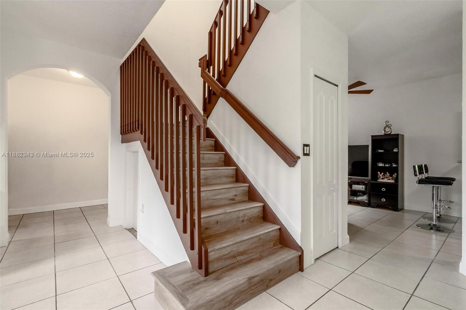 4455 Southwest 160th Avenue, Unit 205 Miramar, FL 33027 - Photo 19 of 44 wooden floor with white walls and stairs