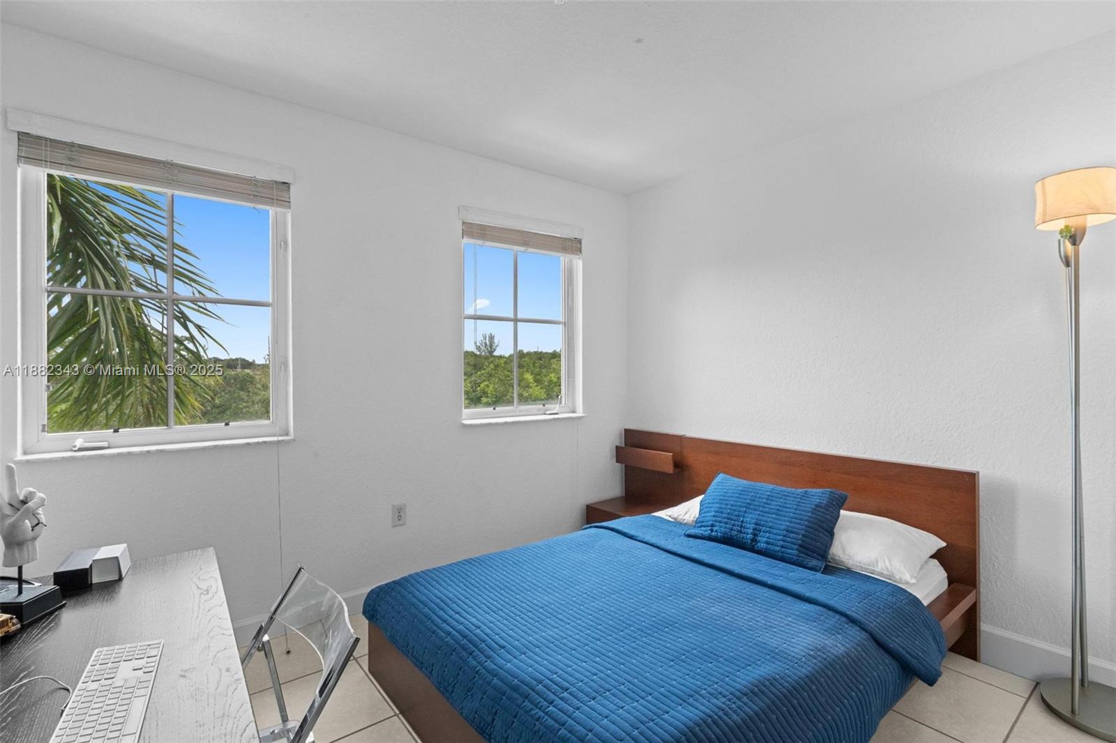 4455 Southwest 160th Avenue, Unit 205 Miramar, FL 33027 - Photo 25 of 44 a bedroom with a bed and a window