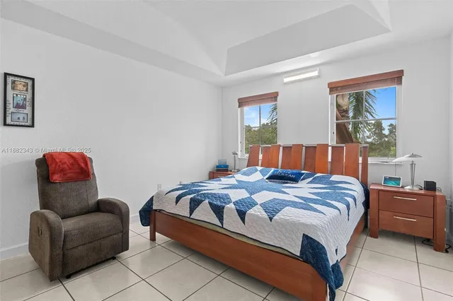 a bedroom with a bed and couch