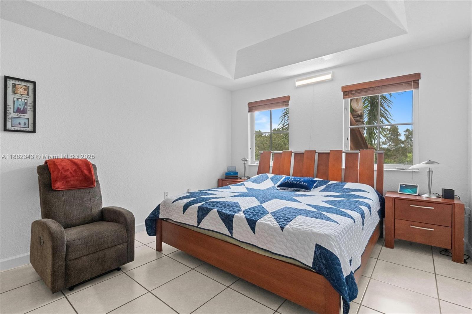 4455 Southwest 160th Avenue, Unit 205 Miramar, FL 33027 - Photo 29 of 44 a bedroom with a bed and couch