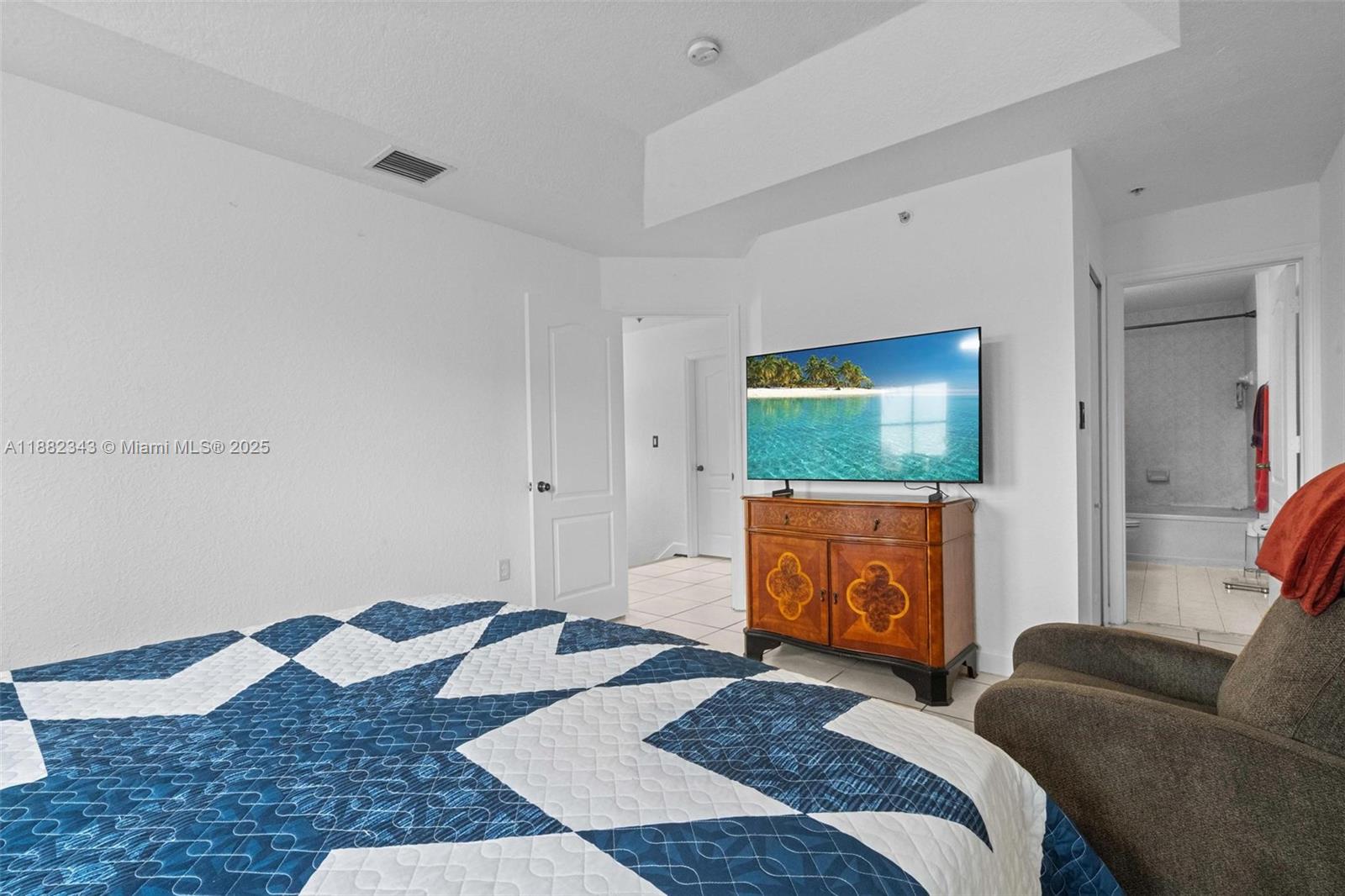 4455 Southwest 160th Avenue, Unit 205 Miramar, FL 33027 - Photo 31 of 44 a bedroom with a bed and couch