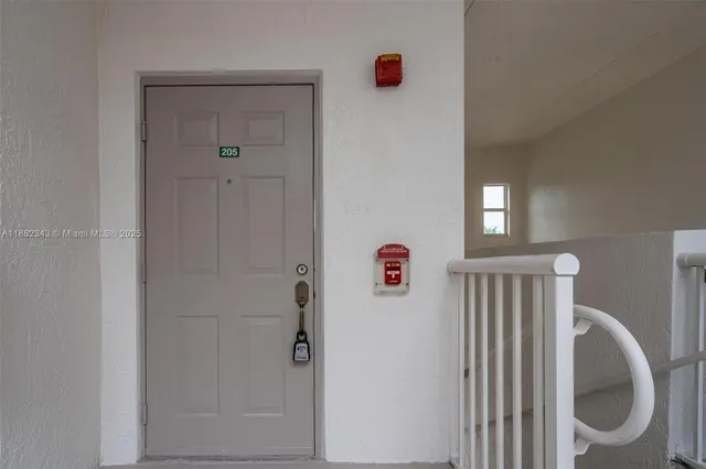 a bathroom with a shower and a window
