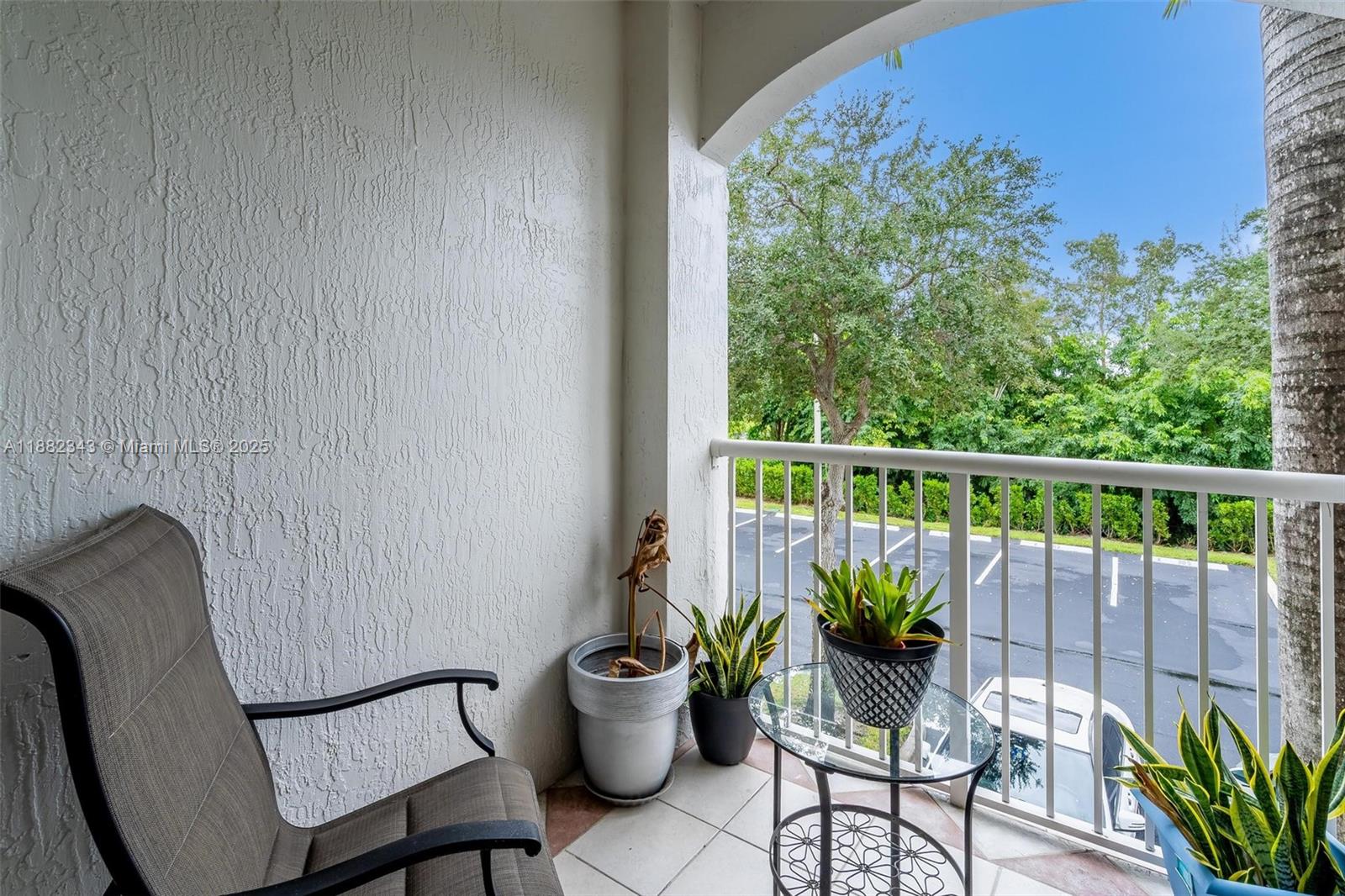 4455 Southwest 160th Avenue, Unit 205 Miramar, FL 33027 - Photo 9 of 44 a balcony with wooden floor