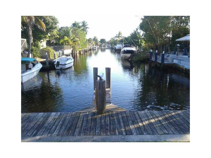 520 Southwest 15th Street, Unit 101 Pompano Beach, FL 33060 - Photo 5 of 9 a swimming pool view with a lake view