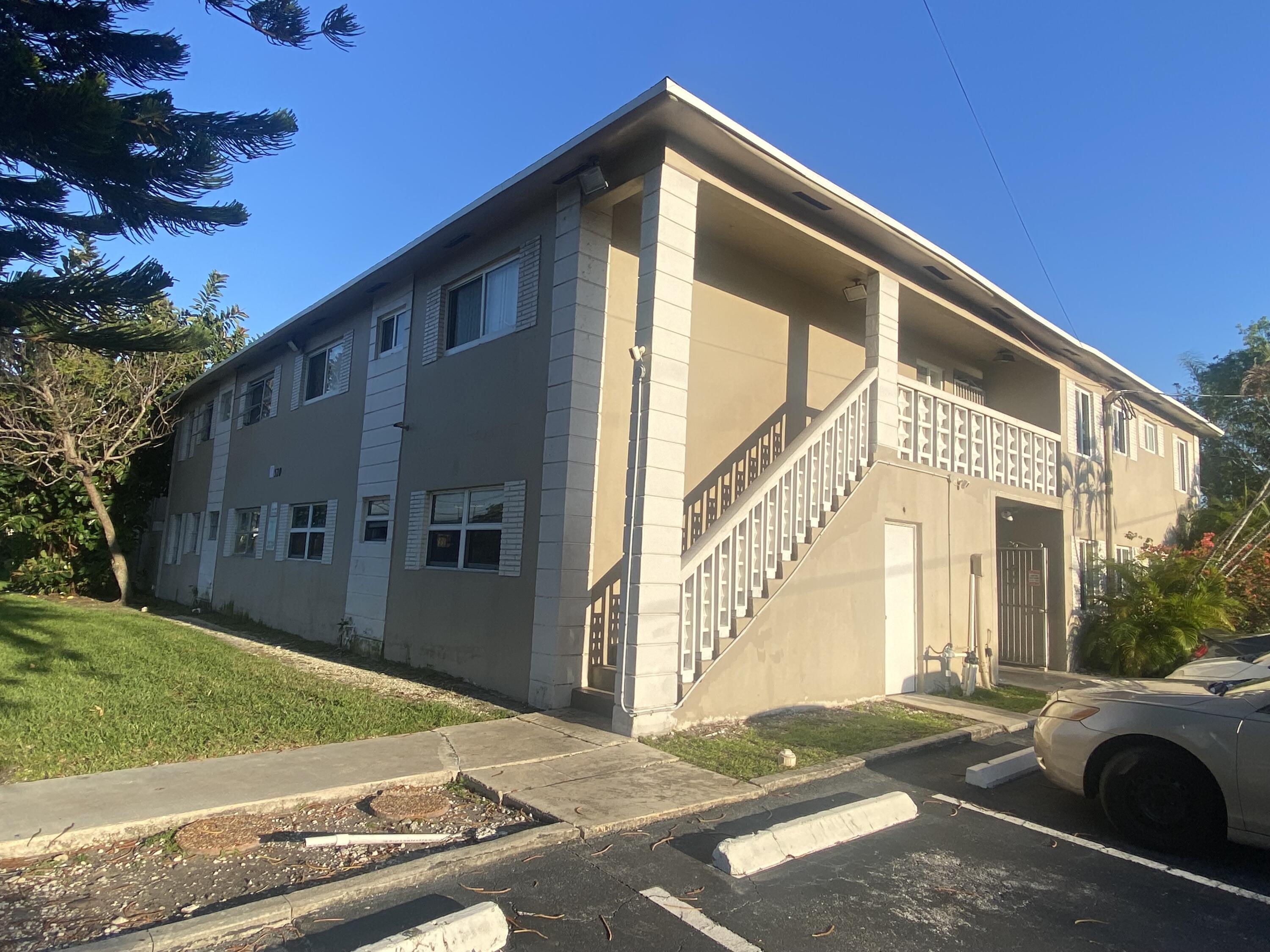 520 Southwest 15th Street, Unit 101 Pompano Beach, FL 33060 - Photo 7 of 9 a front view of a house with garden