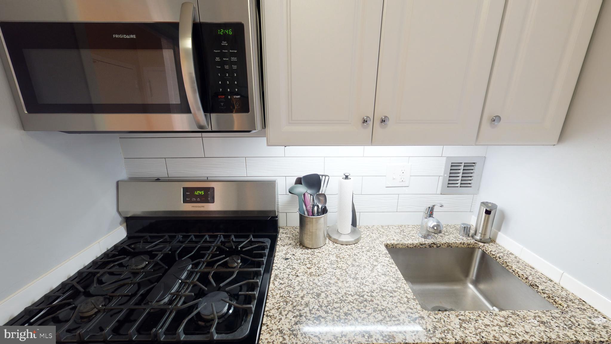 1111 Arlington Boulevard, Unit 731 Arlington, VA 22209 - Photo 11 of 46 a kitchen with sink and cabinets