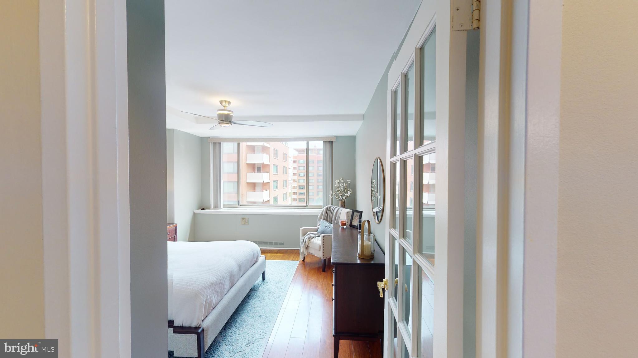 1111 Arlington Boulevard, Unit 731 Arlington, VA 22209 - Photo 13 of 46 a living room with furniture and a window