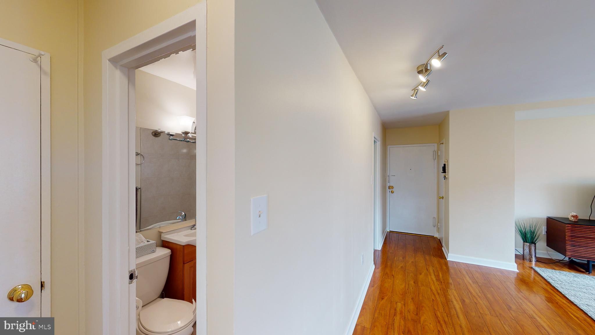 1111 Arlington Boulevard, Unit 731 Arlington, VA 22209 - Photo 14 of 46 a bathroom with a toilet and a shower