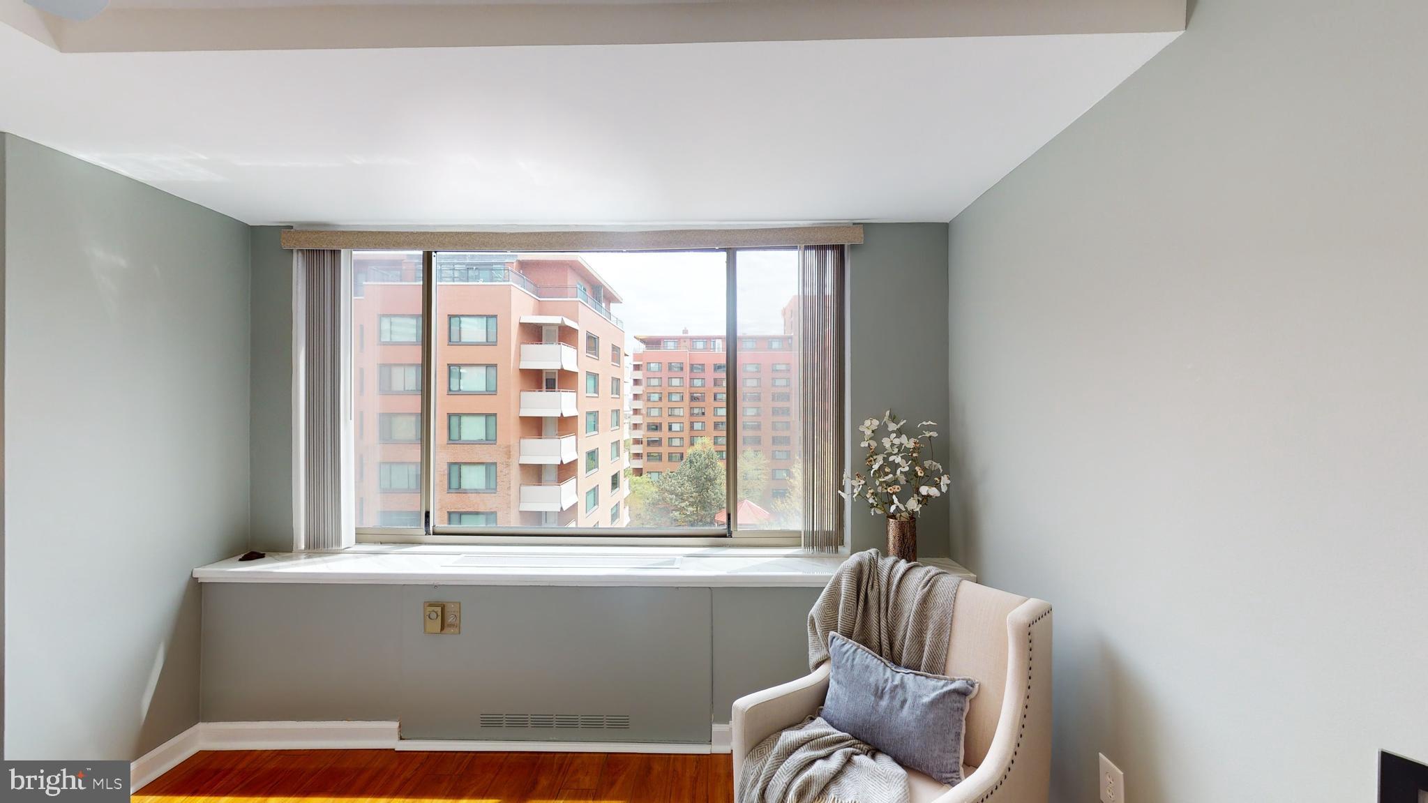 1111 Arlington Boulevard, Unit 731 Arlington, VA 22209 - Photo 19 of 46 a living room with furniture and a window