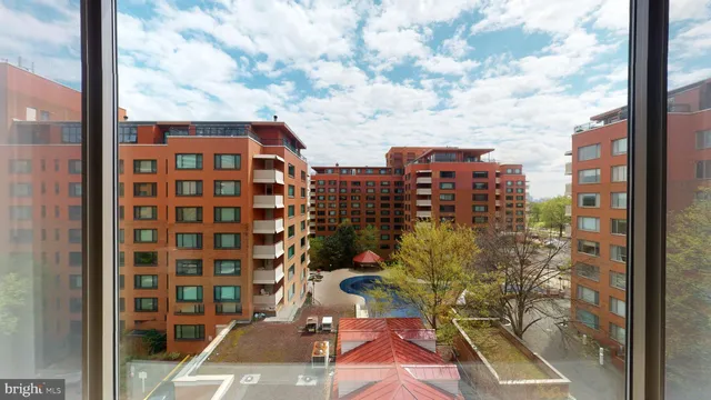 a view of balcony with large windows