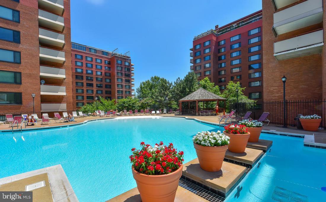 1111 Arlington Boulevard, Unit 731 Arlington, VA 22209 - Photo 37 of 46 a table and chairs in front of building