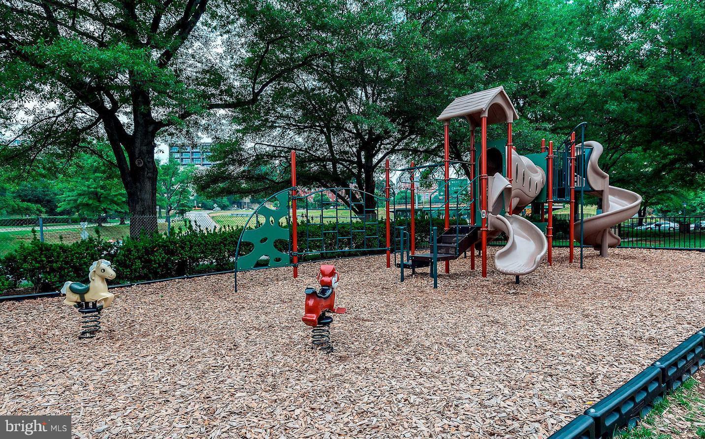 1111 Arlington Boulevard, Unit 731 Arlington, VA 22209 - Photo 42 of 46 a childrens park with lots of swings and slides