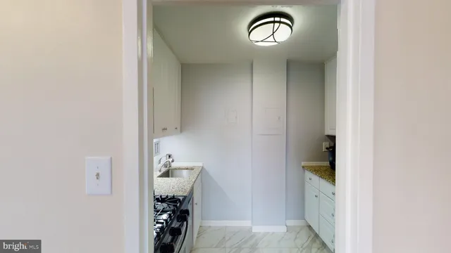 a view of living room with furniture and a flat screen tv