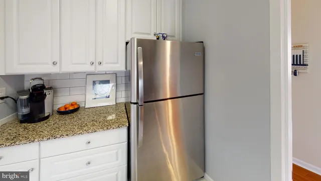 a kitchen with a stove and cabinets