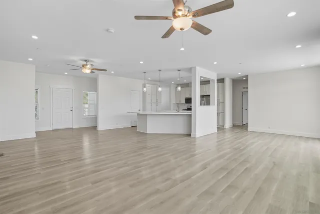 a view of a kitchen with a dishwasher and a refrigerator