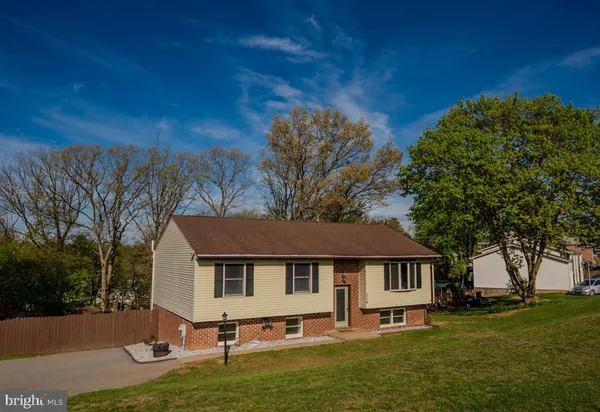 a house that has tree in front of it