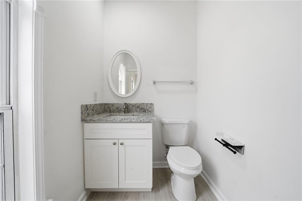 3349 Lathenview Court Alpharetta, GA 30004 - Photo 13 of 48 a bathroom with a granite countertop toilet and a sink