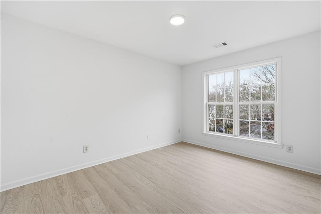 3349 Lathenview Court Alpharetta, GA 30004 - Photo 18 of 48 an empty room with a window