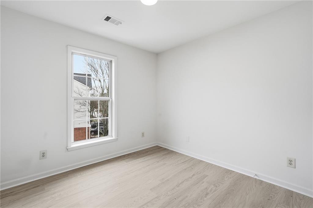 3349 Lathenview Court Alpharetta, GA 30004 - Photo 20 of 48 an empty room with windows