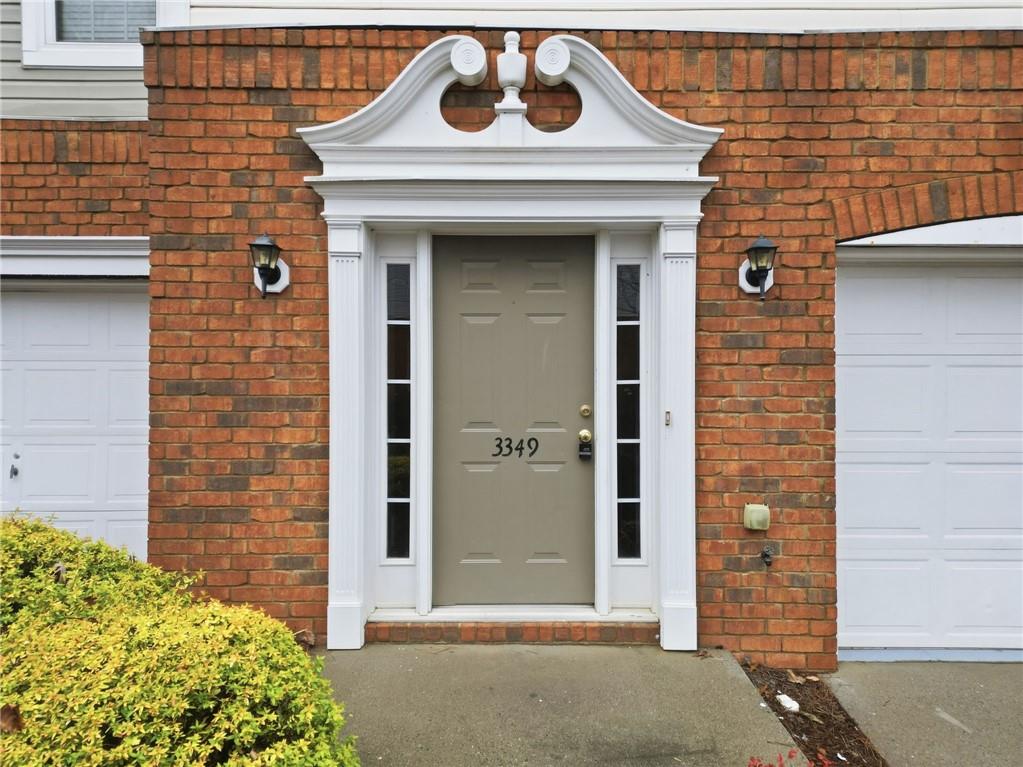 3349 Lathenview Court Alpharetta, GA 30004 - Photo 2 of 48 a front view of a house with a yard