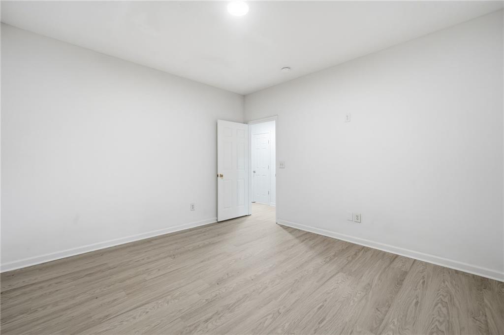 3349 Lathenview Court Alpharetta, GA 30004 - Photo 24 of 48 a view of an empty room and wooden floor