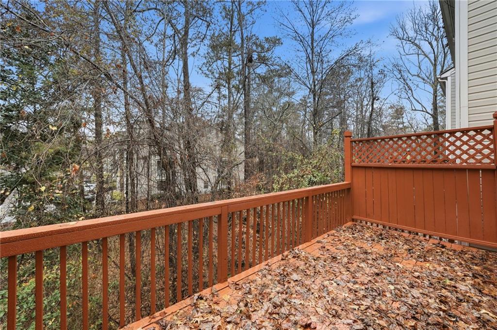 3349 Lathenview Court Alpharetta, GA 30004 - Photo 28 of 48 a balcony with trees in front of it