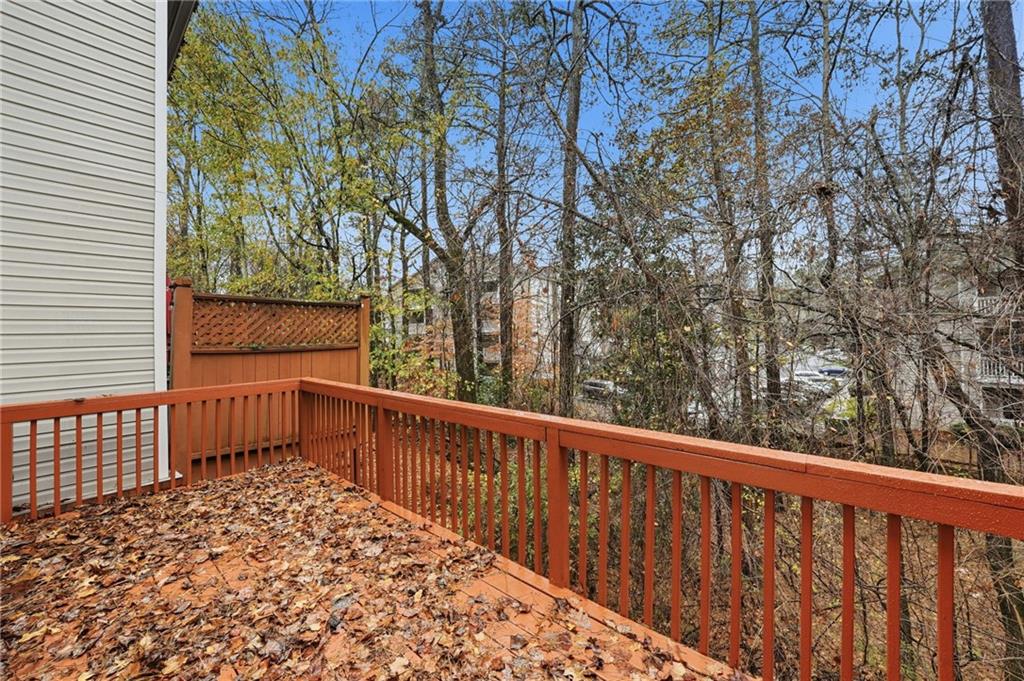 3349 Lathenview Court Alpharetta, GA 30004 - Photo 29 of 48 a view of a balcony with wooden fence