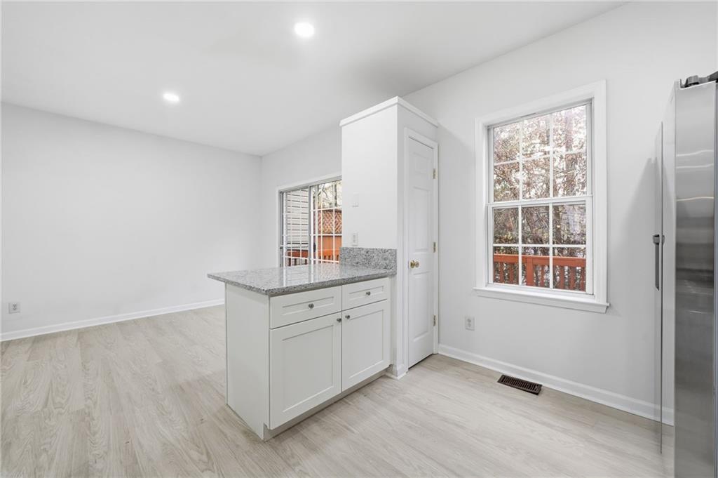 3349 Lathenview Court Alpharetta, GA 30004 - Photo 8 of 48 a room with a window and dresser