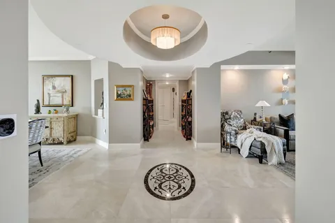 a view of a livingroom with furniture and a ceiling fan