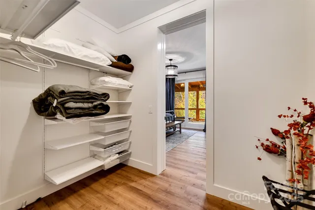 a utility room with wooden floor