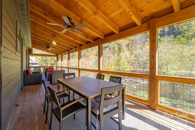 a view of a balcony dining area with furniture
