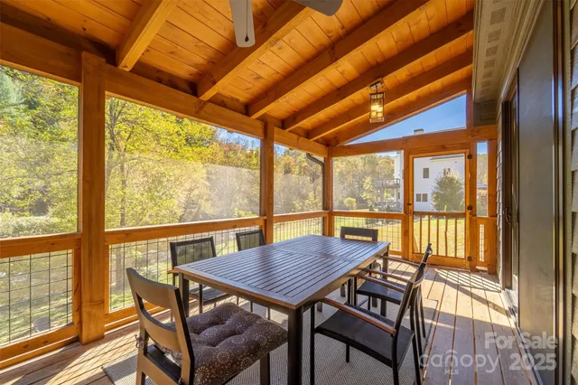 a living room with furniture a large window