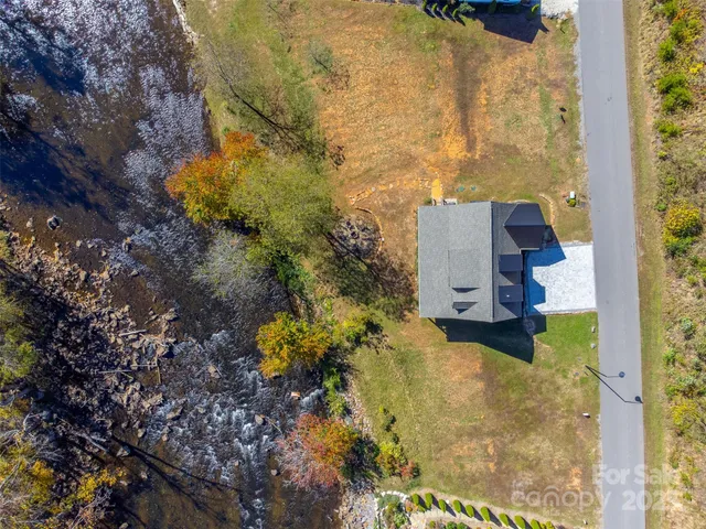 an aerial view of a house with a garden