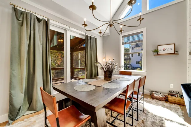 a large kitchen with a table and chairs