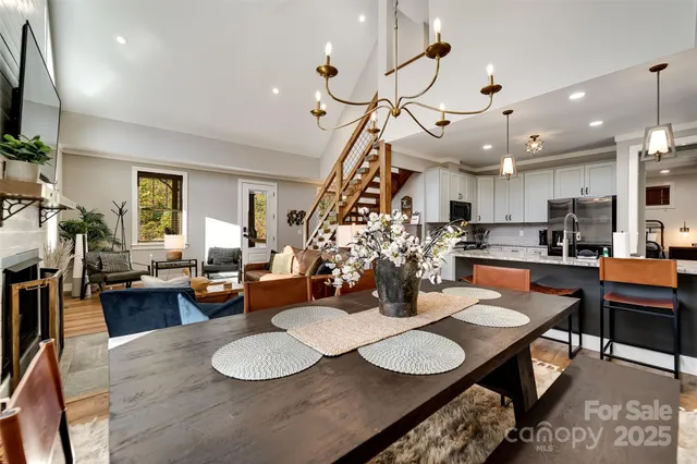 a kitchen with stainless steel appliances kitchen island granite countertop a stove a sink and a refrigerator