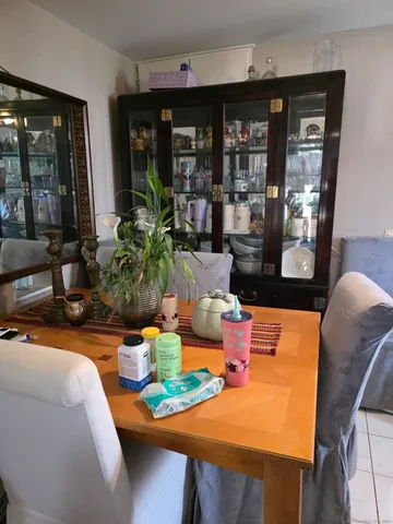 a dining room with furniture and window
