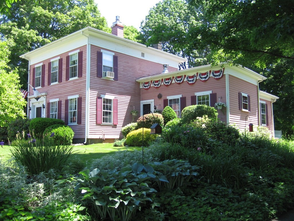48 Main Street Wales, MA 01081 - Photo 1 of 42 a front view of a house with yard and green space