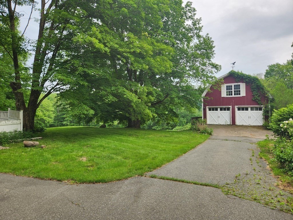 48 Main Street Wales, MA 01081 - Photo 12 of 42 a view of a big house with a big yard and large trees