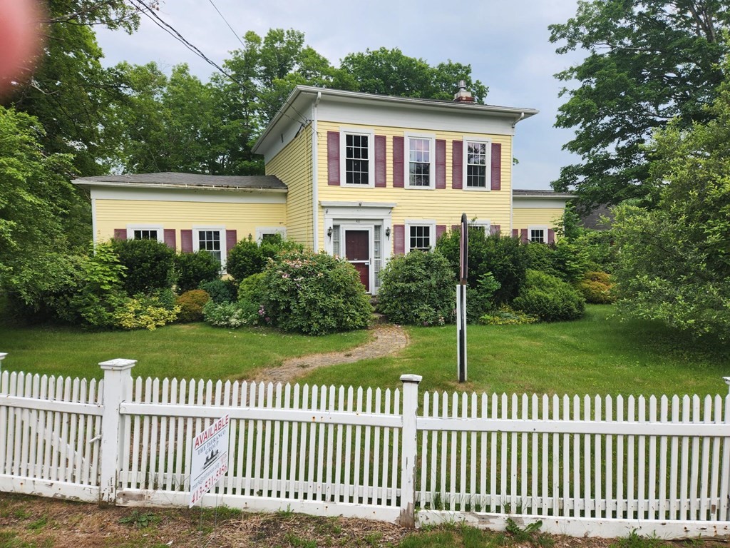 48 Main Street Wales, MA 01081 - Photo 2 of 42 a front view of a house with a garden