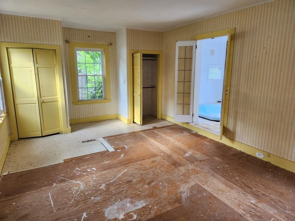 48 Main Street Wales, MA 01081 - Photo 21 of 42 an empty room with windows and closet