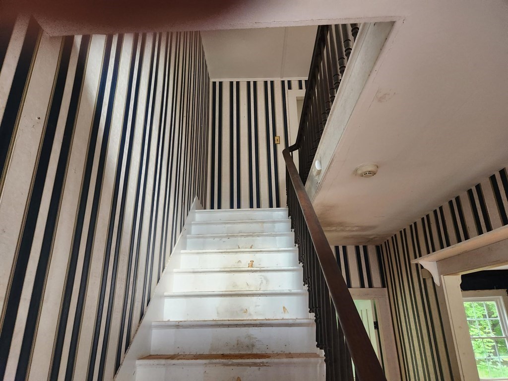 48 Main Street Wales, MA 01081 - Photo 24 of 42 a view of staircase with wooden floor and a window