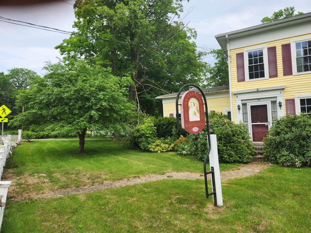 48 Main Street Wales, MA 01081 - Photo 3 of 42 a view of a house with a backyard