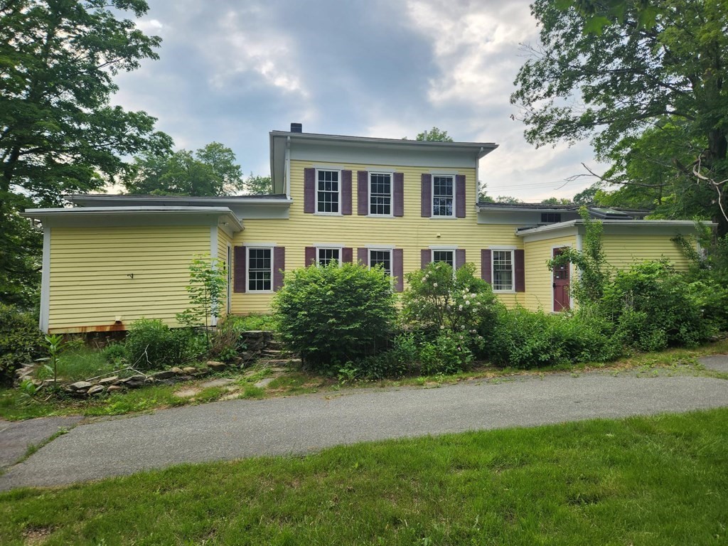 48 Main Street Wales, MA 01081 - Photo 4 of 42 a front view of a house with a garden